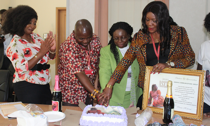  Mrs  Diana Hopeson (middle) joined  by Mr Ransford Tetteh (2nd left) and Ms Adwoa  Serwaa Bonsu (right) to cut the cake to celebrate  her long relation with Graphic. Looking on is Ms Mary Ghansah